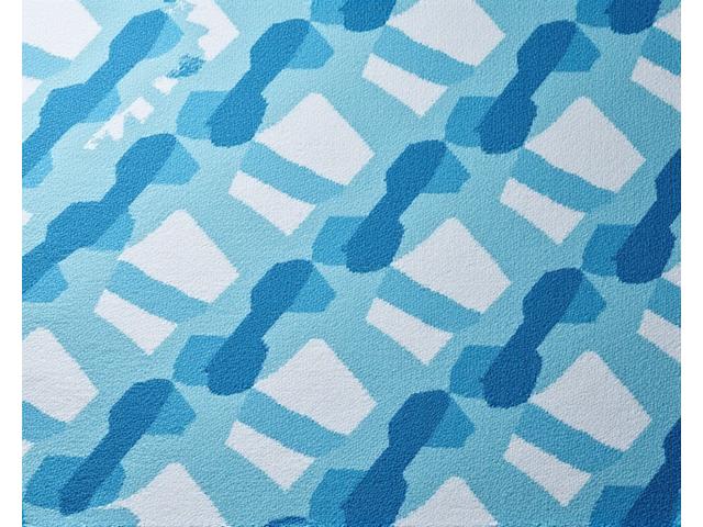 Modern geometric pattern in coastal tones on a beach towel