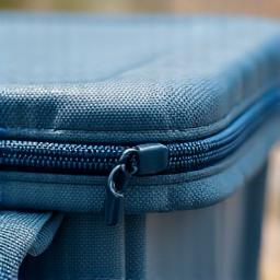 Close-up of a waterproof, sealed zipper on a cooler bag, emphasizing its robust design.